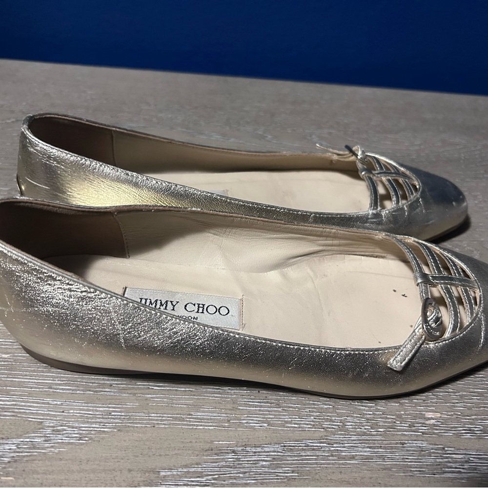 Jimmy Choo Gold Flats with Pointed Toe Design